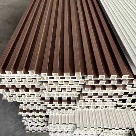Construction worker installing wall panels on job site