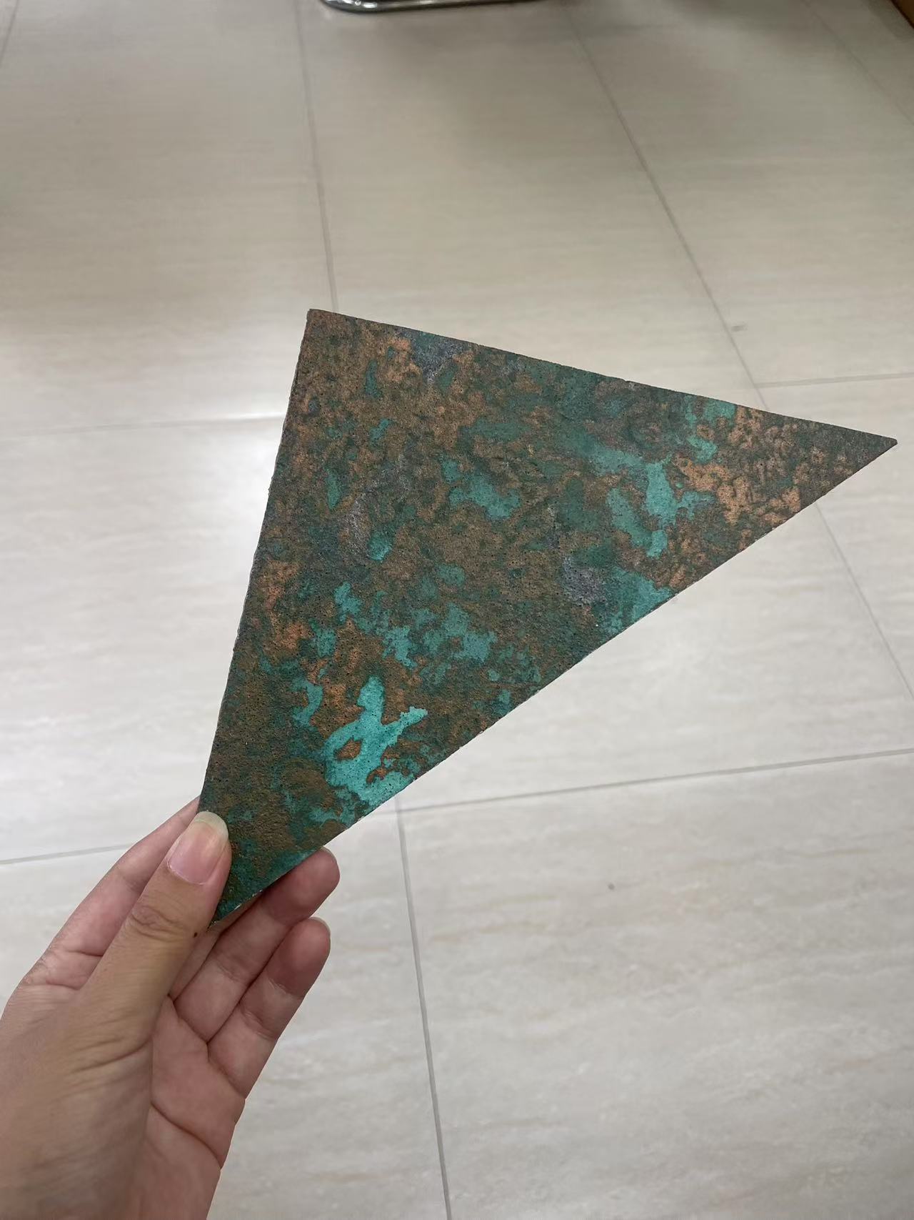 A close-up of a flexible stone surface sample for modular cladding