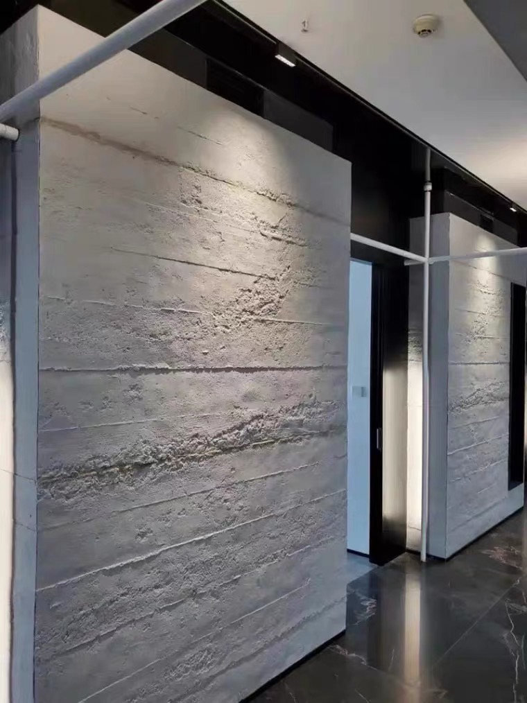 Contractor installing lightweight stone panels on a building facade