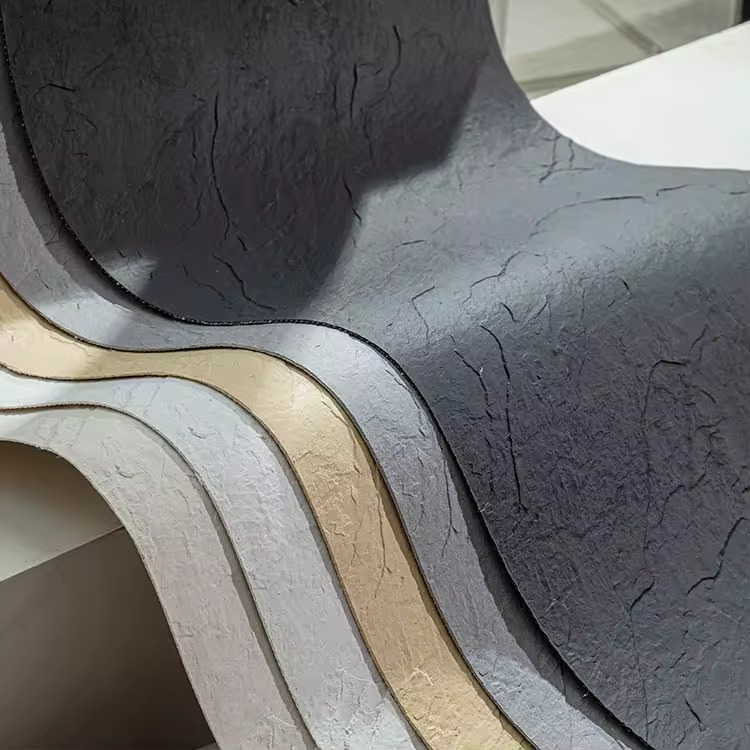 Single worker installing lightweight flexible stone veneer panel demonstrating one-person installation