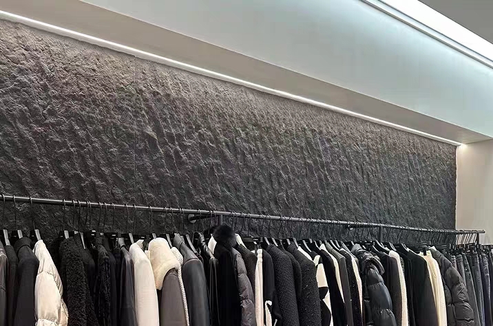 Retail shop interior with flexible stone veneer feature wall