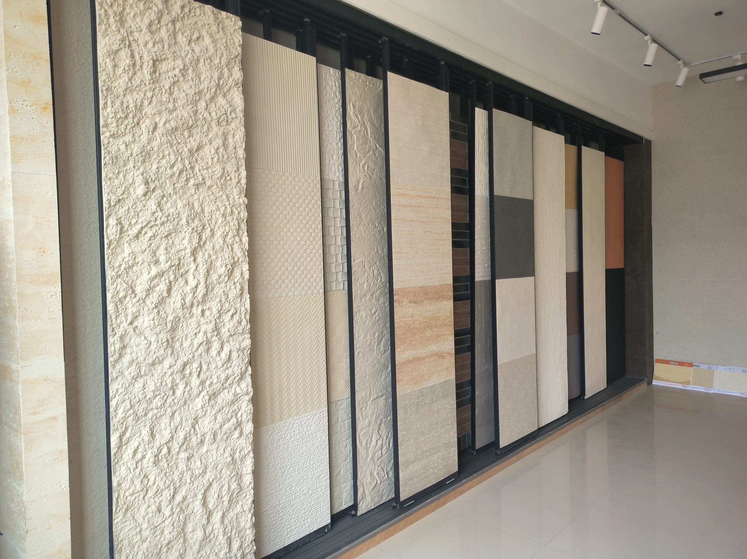 Showroom wall displaying the full range of JMS Decor wall panel samples